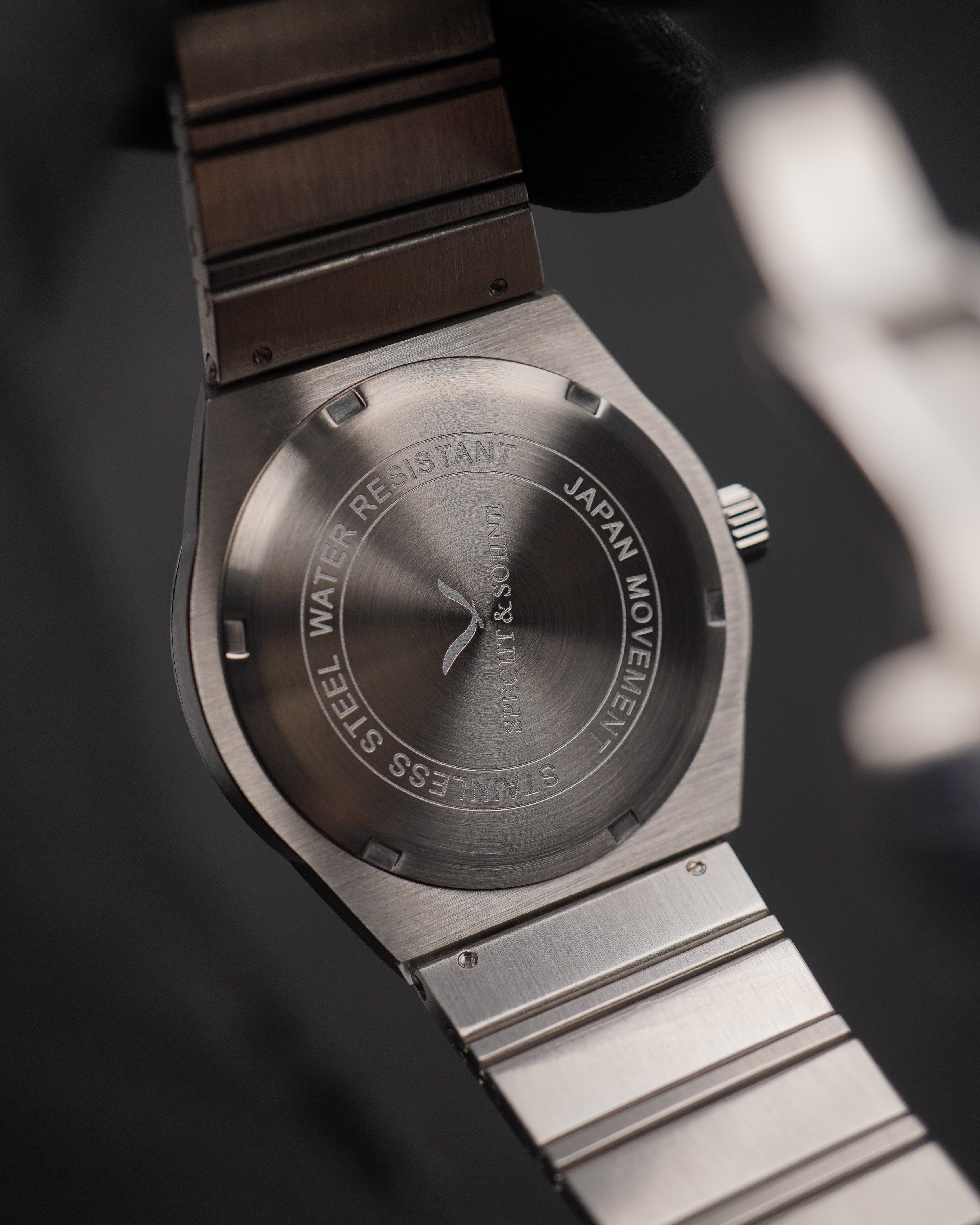 Engraved caseback of a Specht & Sohne automatic reading STAINLESS STEEL WATER RESISTANT and JAPAN MOVEMENT, with no calibre number to look up