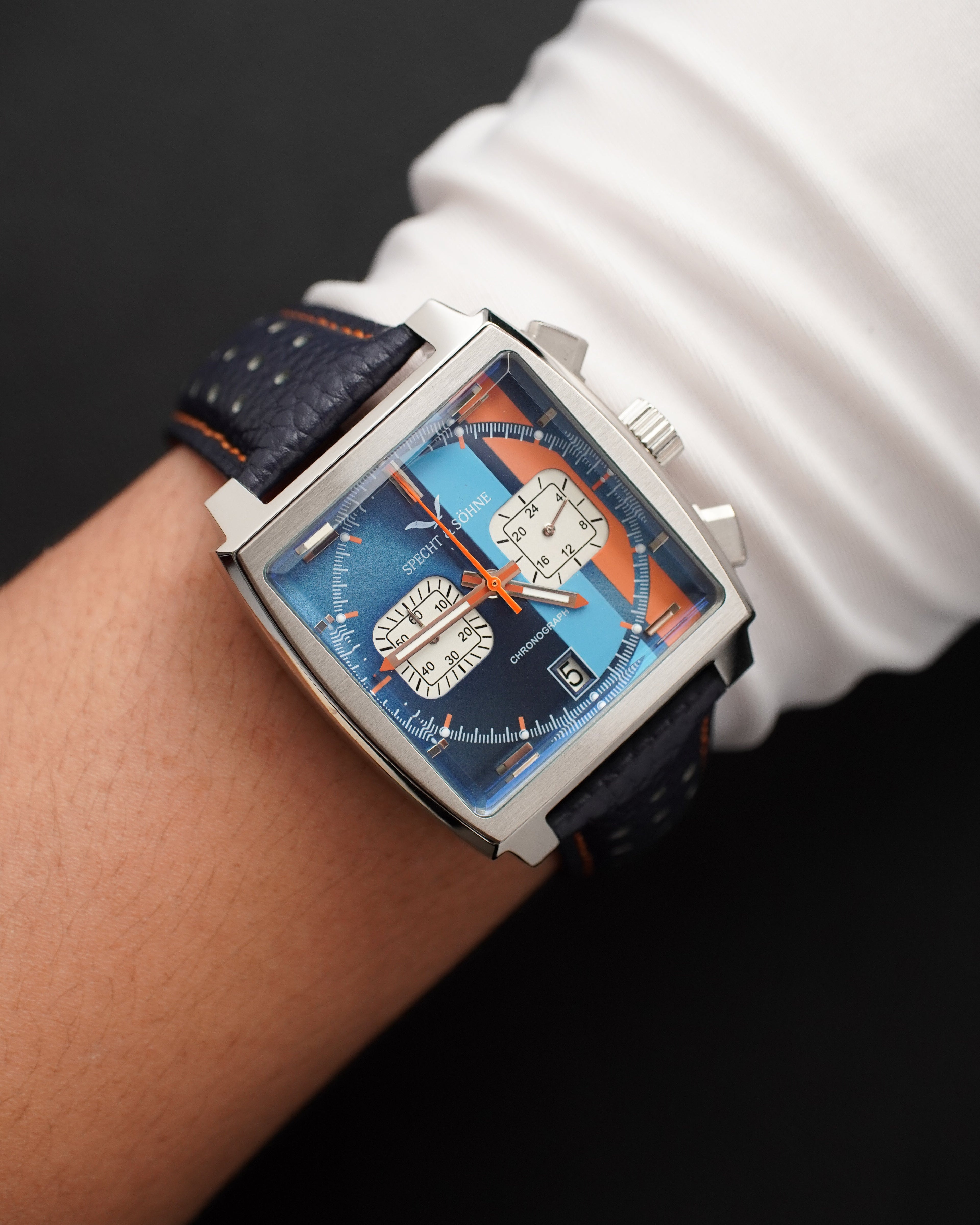 Specht & Sohne SP0009 square-cased racing chronograph with striped blue and orange dial worn on the wrist