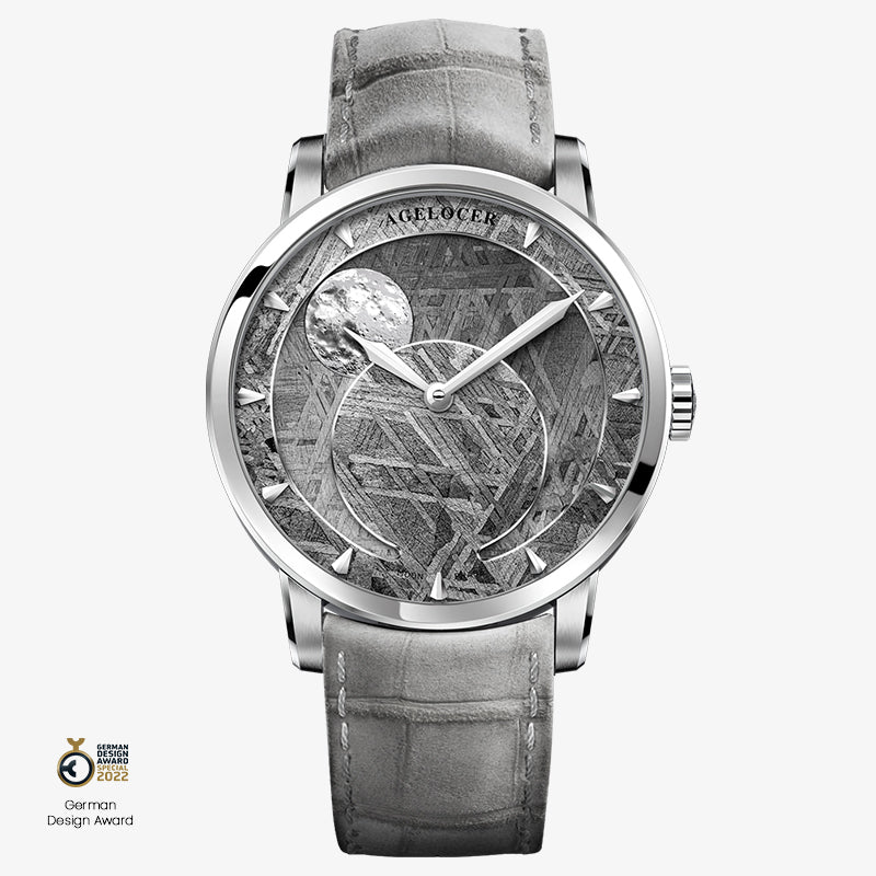 Agelocer Astronomer moonphase watch with a genuine iron meteorite dial and gold accents on a steel bracelet