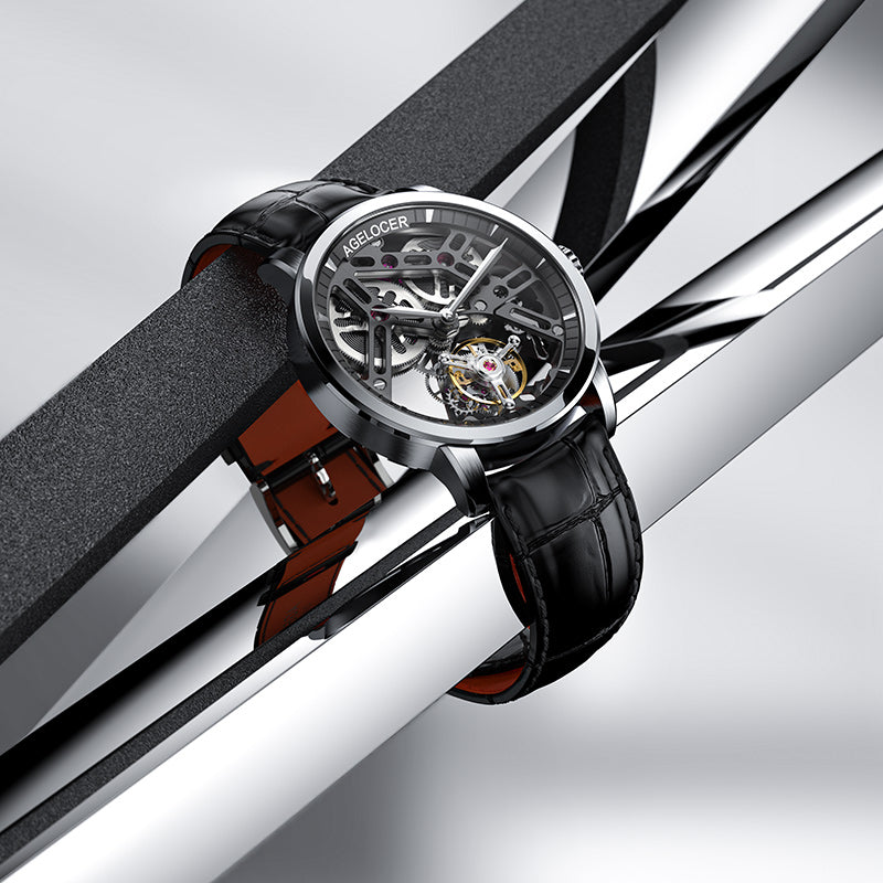 Agelocer Free-Sprung Manual Flying Tourbillon on black leather, gold tourbillon cage visible through the skeleton dial