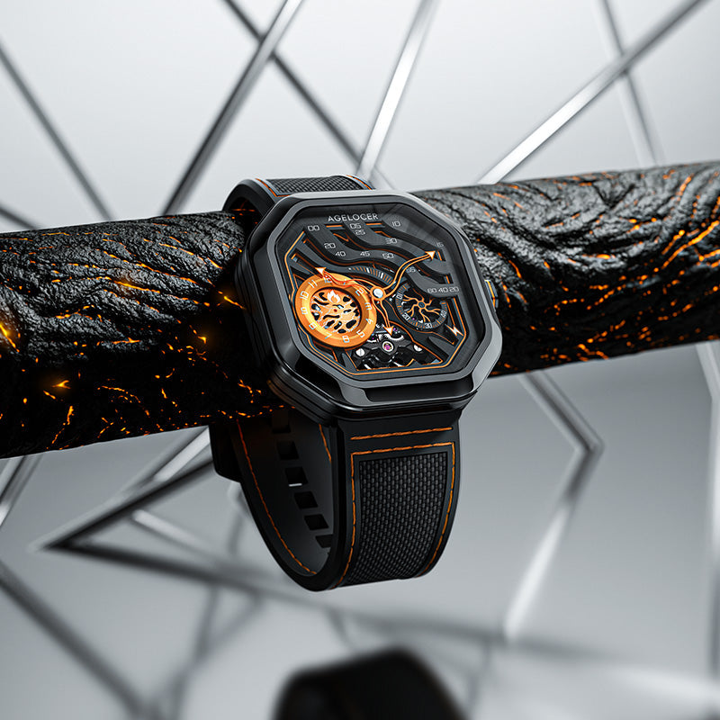 Agelocer Volcano Flame Orange automatic with a black steel case and openworked lava-vein dial on a lava-textured display bar