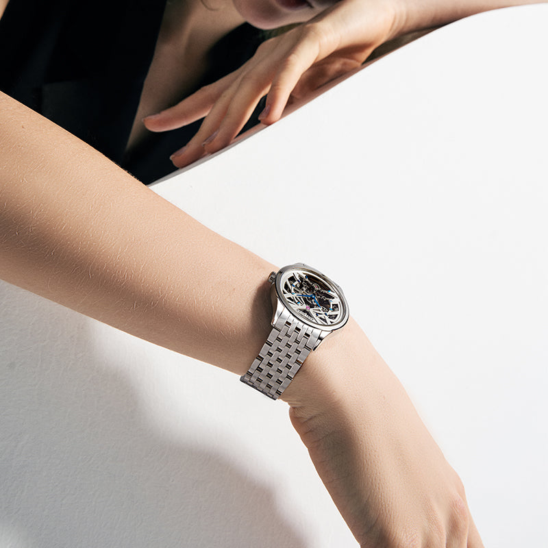 Agelocer Schwarzwald skeleton women's watch, 36mm steel case with open-worked dial, worn on a slender wrist