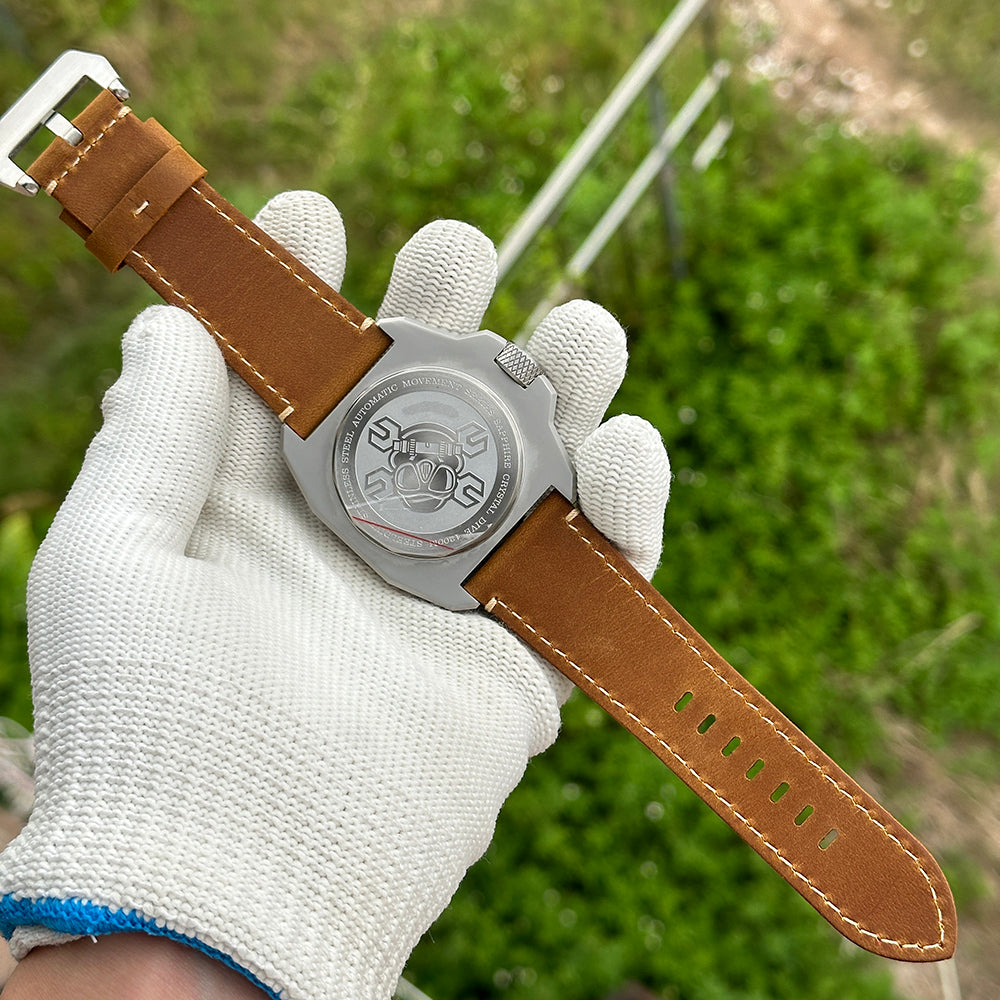 STEELDIVE SD2212 front view on a light brown leather strap, orange bezel in daylight