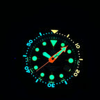 STEELDIVE SD1975XV dial glowing blue and green in the dark with an orange seconds hand