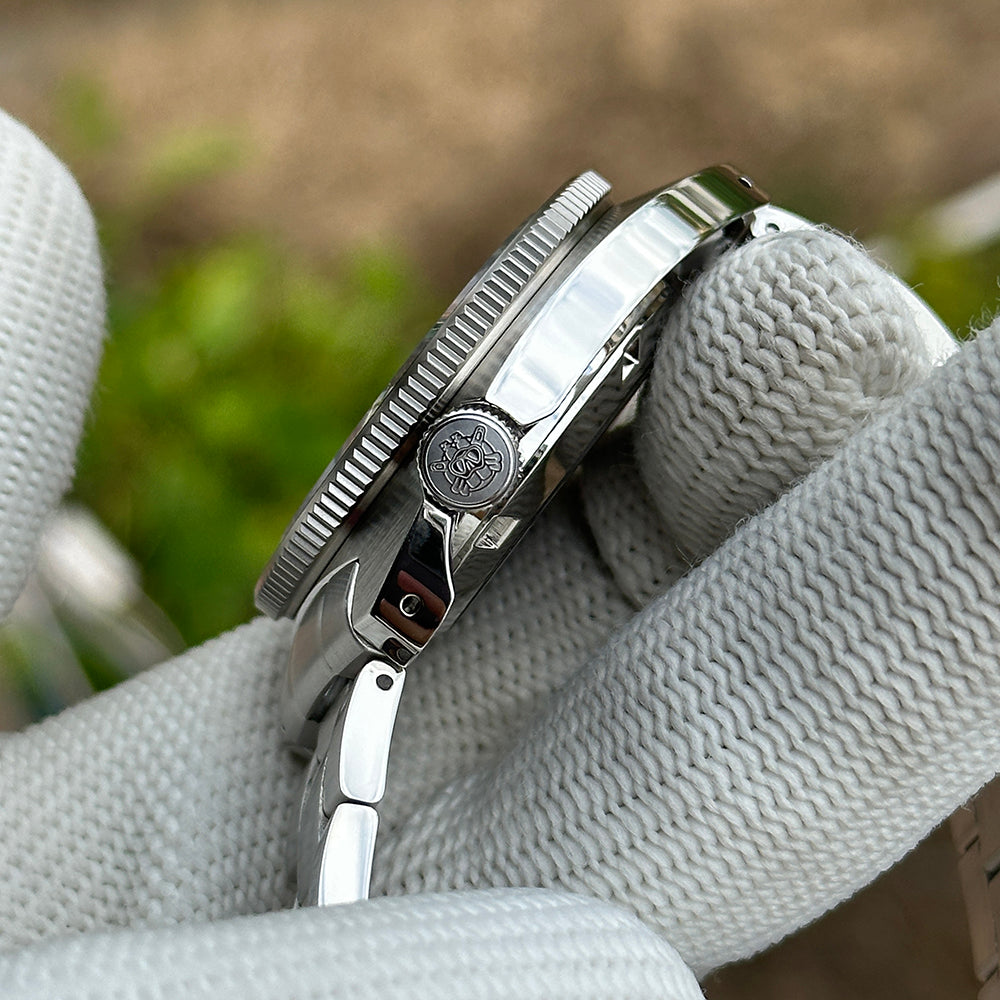 Side profile of the STEELDIVE SD1977T showing the signed crown and steel bracelet