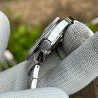 Side profile of the STEELDIVE SD1977T showing the signed crown and steel bracelet