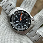 STEELDIVE SD1977T black dial and steel bracelet, angled view showing the ceramic bezel
