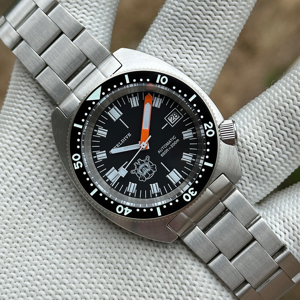 STEELDIVE SD1977T black dial and steel bracelet, angled view showing the ceramic bezel