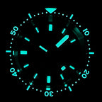 STEELDIVE SD1977T dial glowing blue in the dark, lume on the markers, hands and bezel