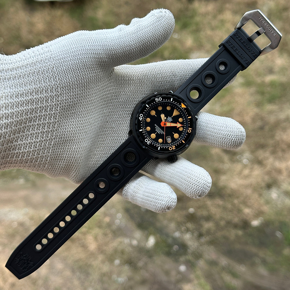 STEELDIVE SD1975XV on a black rubber strap resting across a gloved palm