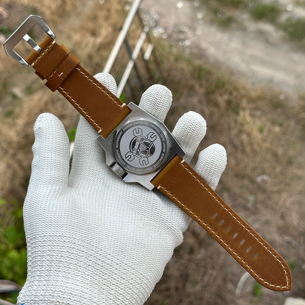 STEELDIVE SD2213 caseback and brown leather strap shown flat on a gloved hand