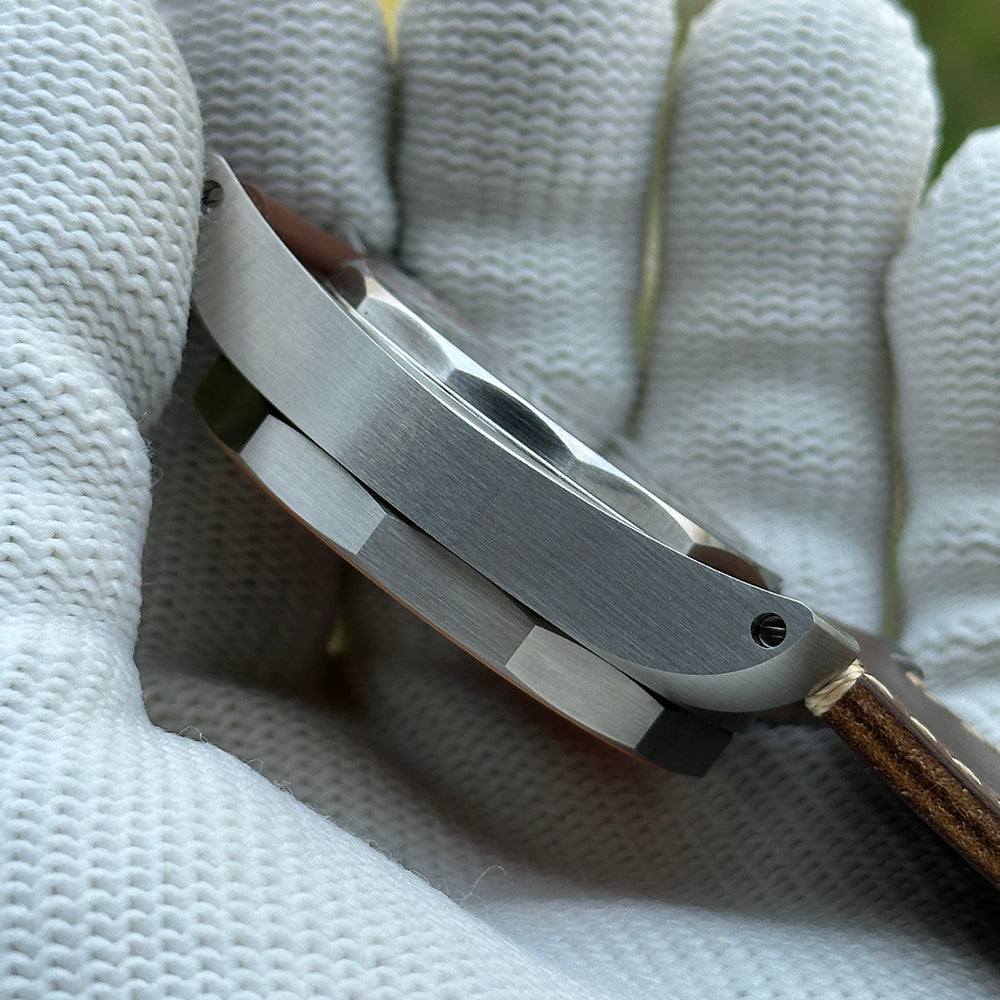 Brushed case side of the STEELDIVE SD2211 shown with its leather strap