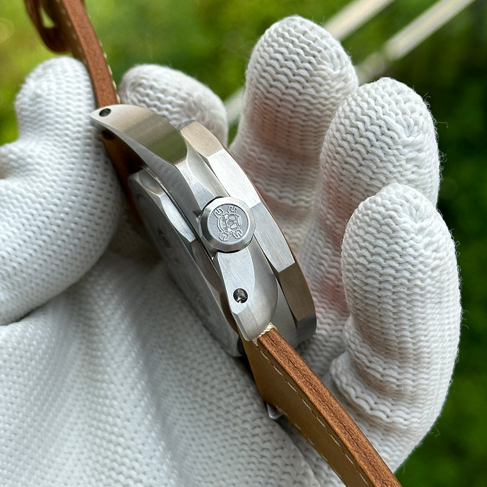 Side profile of the STEELDIVE SD2211 showing the signed crown and brushed case flank