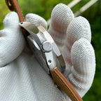 Side profile of the STEELDIVE SD2211 showing the signed crown and brushed case flank