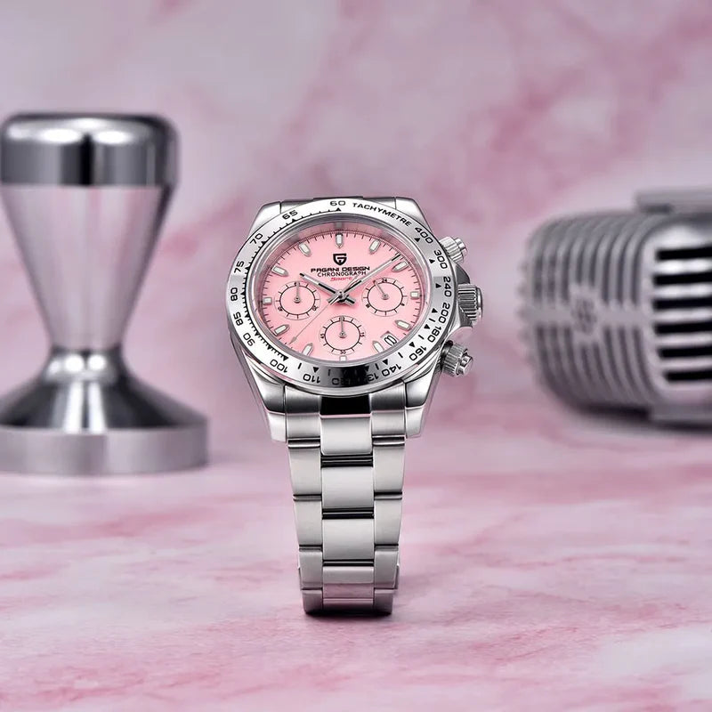 Silver watch with pink face on a pink marble surface