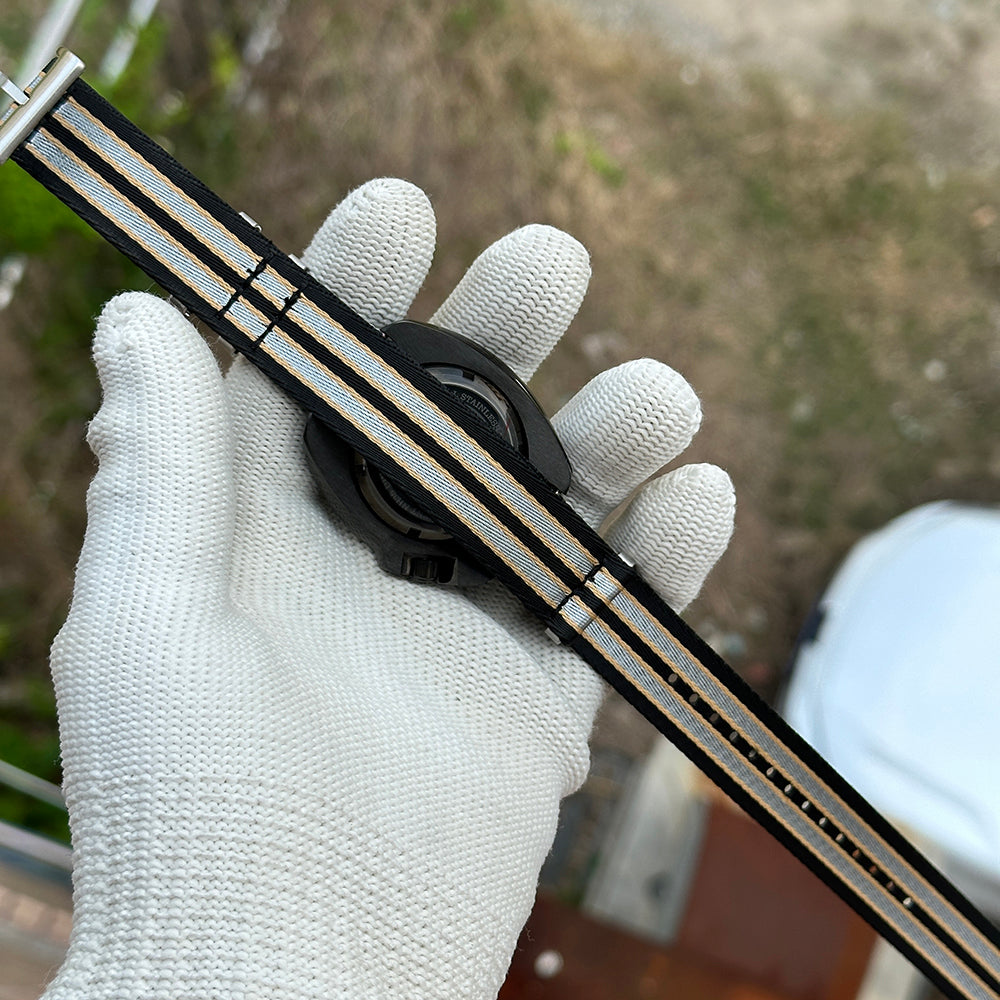 Black and grey striped nylon NATO strap for the STEELDIVE SD1970X, shown unfastened