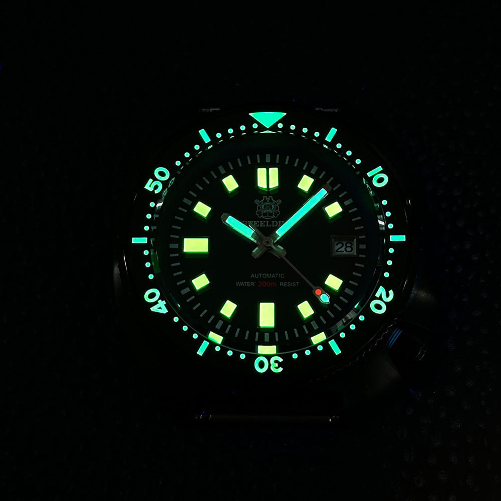 STEELDIVE SD1970X dial glowing green and blue in the dark, lume on the hands, markers and bezel