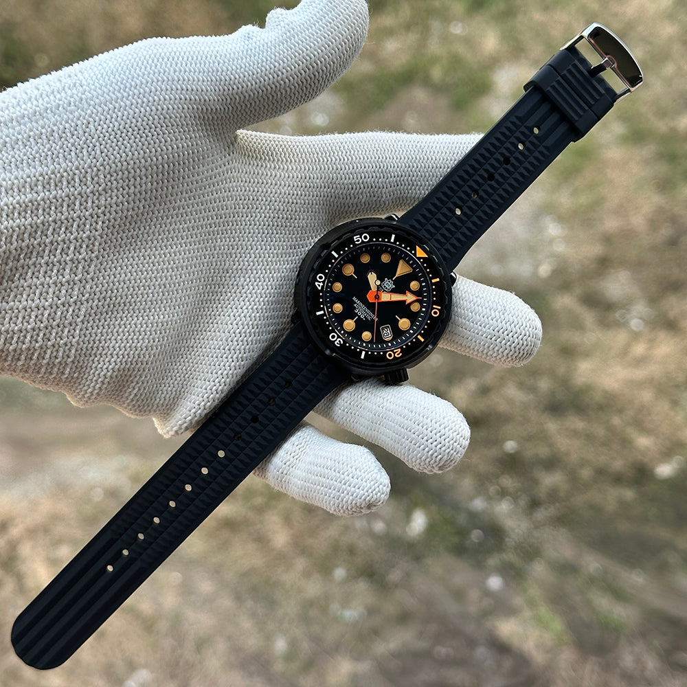 STEELDIVE SD1975XV on a black waffle rubber strap held in a gloved hand