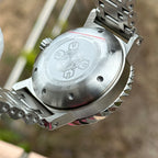 Engraved caseback of the STEELDIVE SD1982F on its steel bracelet