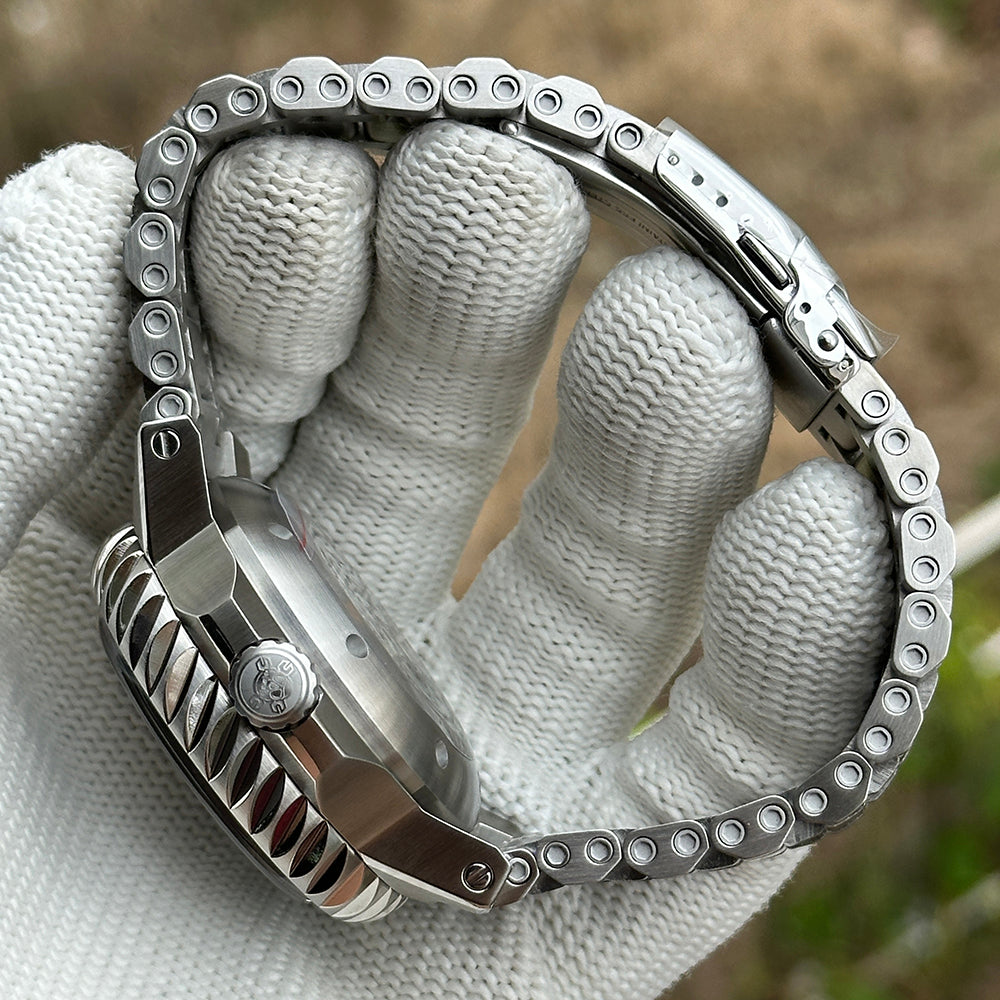STEELDIVE SD1982F case side and steel bracelet curved across a gloved hand