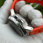 Side profile of the STEELDIVE SD1982F showing the fluted bezel edge and orange strap