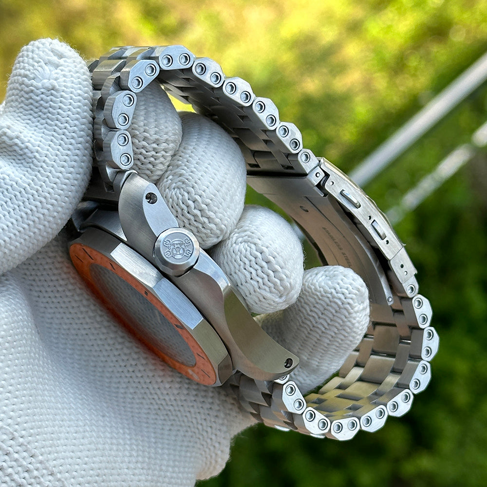 STEELDIVE SD2211 steel tank bracelet curved across a gloved hand showing the link screws