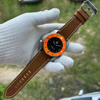 STEELDIVE SD2211 on a light brown leather strap resting across a gloved palm