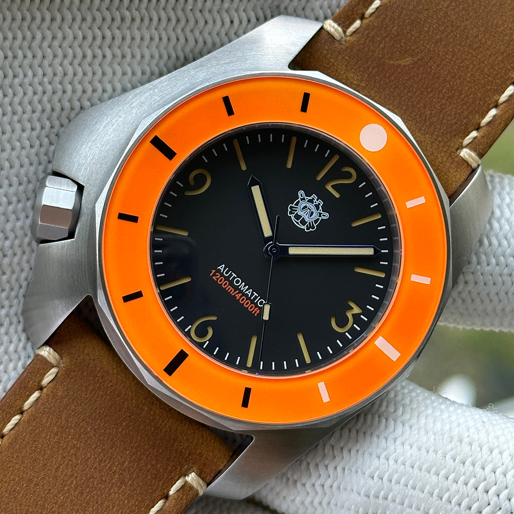 STEELDIVE SD2211 orange bezel dive watch with black dial on a light brown leather strap