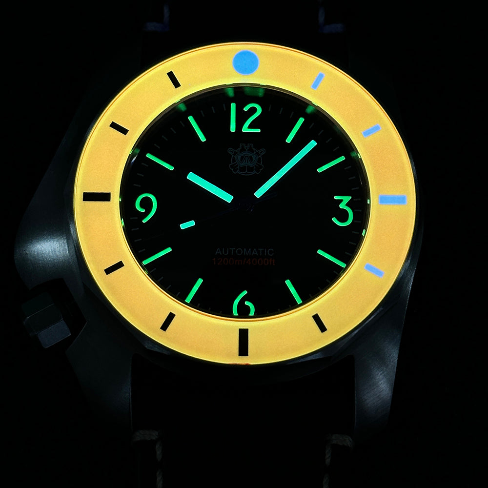 STEELDIVE SD2211 glowing in the dark, orange bezel lit yellow and the markers green