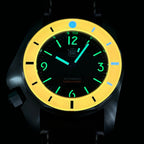 STEELDIVE SD2211 glowing in the dark on a leather strap, orange bezel lit yellow