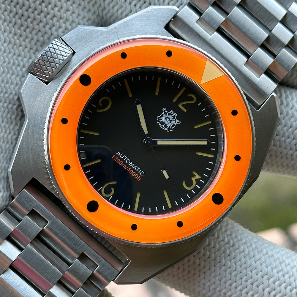 STEELDIVE SD2212 orange bezel dive watch with black dial on a steel tank bracelet