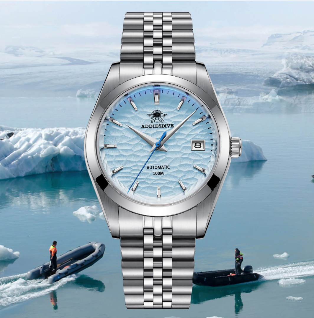 Silver watch with blue wave pattern dial against a backdrop of icebergs and people on rafts.