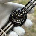 STEELDIVE SD1970X black PVD dive watch on a black and grey striped nylon NATO strap