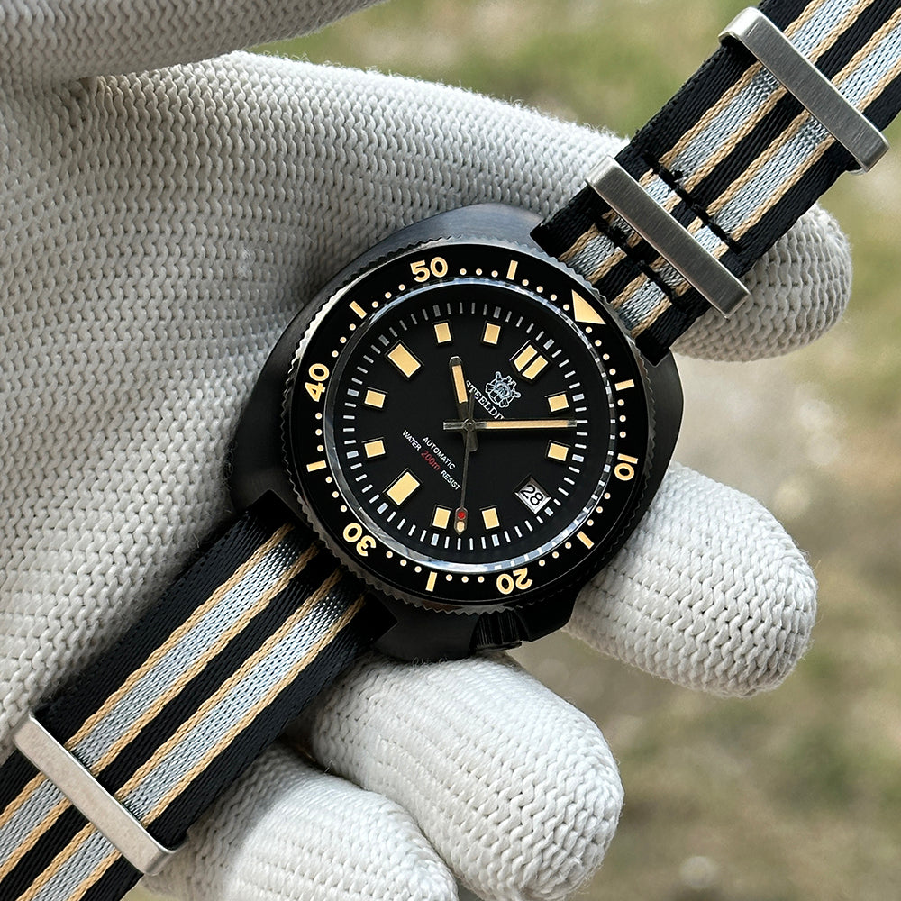 STEELDIVE SD1970X black PVD dive watch on a black and grey striped nylon NATO strap