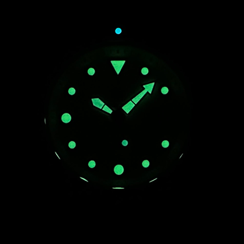 STEELDIVE SD1975B dial glowing green in the dark, showing the lume plots and hands