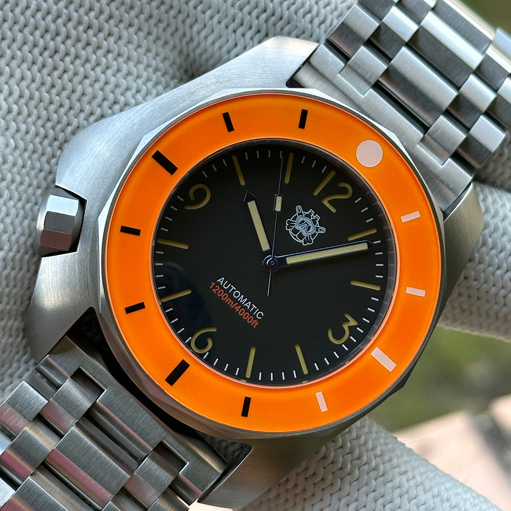 STEELDIVE SD2211 orange bezel dive watch with black dial on a steel tank bracelet