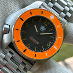 STEELDIVE SD2211 black dial and orange bezel on a steel tank bracelet