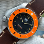STEELDIVE SD2211 orange bezel dive watch with black dial on a dark brown leather strap