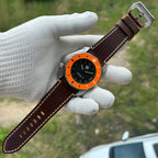 STEELDIVE SD2211 on a dark brown leather strap laid full length on a gloved hand