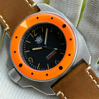 STEELDIVE SD2212 black dial and orange bezel on a dark brown leather strap, angled