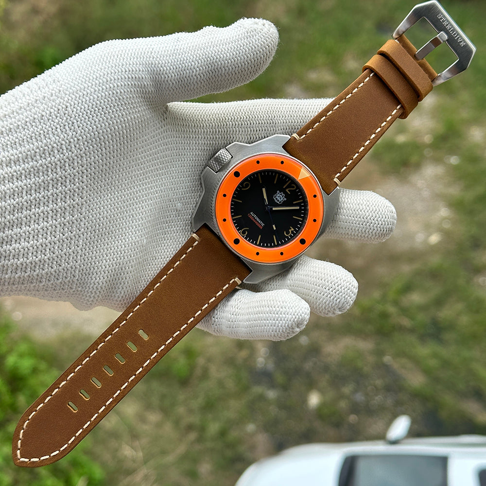 STEELDIVE SD2212 black dial and orange bezel on a light brown leather strap