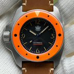STEELDIVE SD2212 on a brown leather strap held across a gloved palm