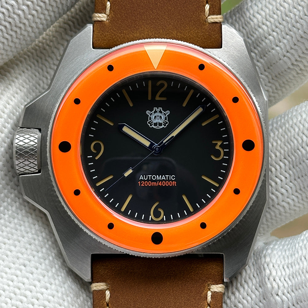 STEELDIVE SD2212 on a brown leather strap held across a gloved palm