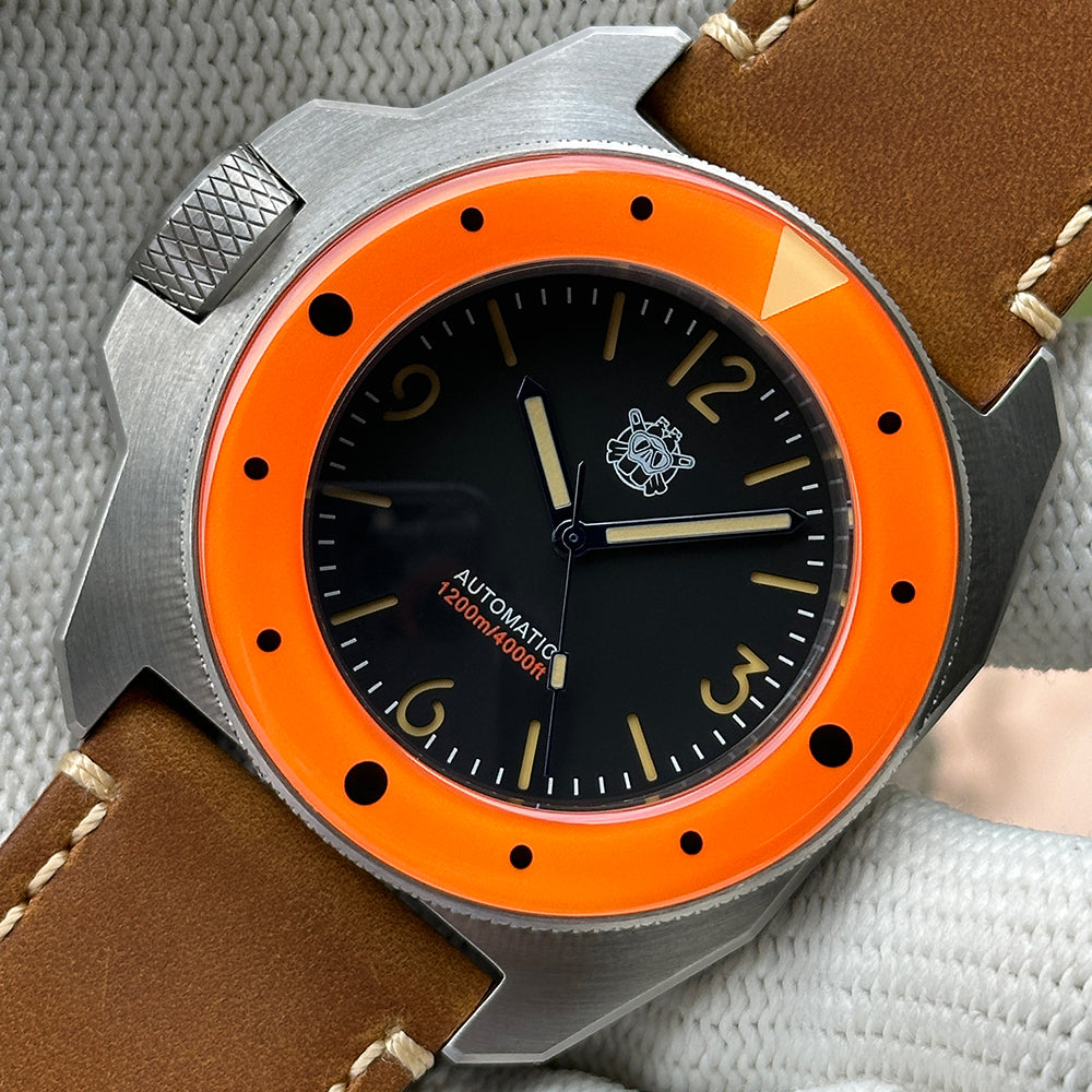 STEELDIVE SD2212 orange bezel dive watch with black dial on a light brown leather strap