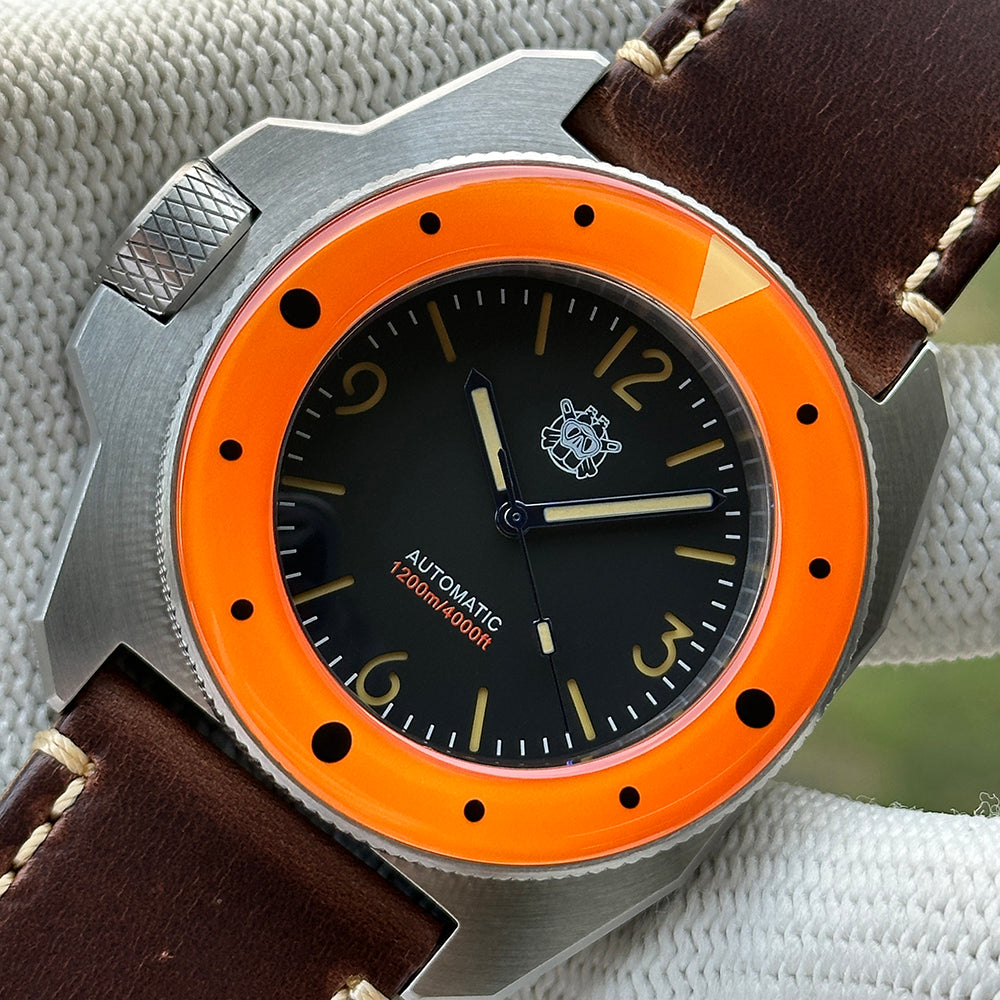 STEELDIVE SD2212 orange bezel dive watch with black dial on a dark brown leather strap