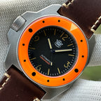 STEELDIVE SD2212 black dial and orange bezel on a dark brown leather strap