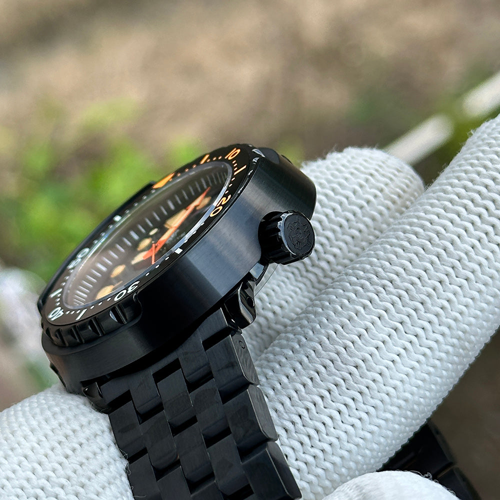 Side profile of the STEELDIVE SD1975XV showing the signed crown and black PVD bracelet