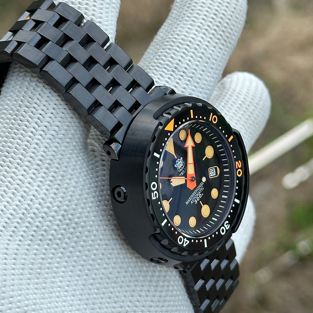 STEELDIVE SD1975XV black dial with orange accents on a black PVD bracelet, three-quarter view