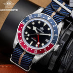 ADDIESDIVE AD2044 GMT with black dial, Pepsi bezel and blue-tan NATO strap, lifestyle shot on black leather