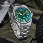 ADDIESDIVE AD2055 39MM NH35 automatic field watch with green sunburst dial and steel bracelet, lifestyle shot on tactical bag